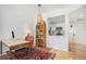 Cozy home office setup with a desk, chair, and view into the kitchen at 180 Cook St # 406, Denver, CO 80206