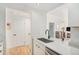 Modern home interior with open kitchen and living area, offering a spacious and inviting atmosphere at 180 Cook St # 406, Denver, CO 80206