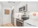 Sleek kitchen features stainless steel appliances and plenty of storage space at 180 Cook St # 406, Denver, CO 80206
