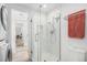 Glass enclosed shower with white subway tile and neutral fixtures, providing a clean and modern look at 180 Cook St # 406, Denver, CO 80206
