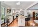 Spacious updated kitchen featuring an island with bar seating, stainless appliances and ample counter space at 1641 S Parfet Ct, Denver, CO 80232