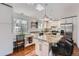 Modern kitchen with granite counters, stainless steel appliances, and a breakfast bar area at 1641 S Parfet Ct, Denver, CO 80232