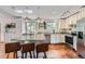Bright, updated kitchen featuring granite countertops, stainless steel appliances, and a large island at 1641 S Parfet Ct, Denver, CO 80232