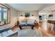 Inviting living area with hardwood floors, modern decor, and a comfortable sofa at 1641 S Parfet Ct, Denver, CO 80232