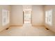 Spacious bedroom with neutral walls and large windows featuring plantation shutters for optimal natural light at 3231 Oak St, Wheat Ridge, CO 80033