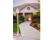 Exterior shot of a home with a lamp post on the lawn and landscaped walkway to the front door at 3231 Oak St, Wheat Ridge, CO 80033