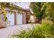 Lovely home featuring an attached two-car garage and elegant brick and siding exterior at 3231 Oak St, Wheat Ridge, CO 80033