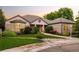 Beautiful brick home with well-maintained landscaping, a bay window, and an inviting entrance at 3231 Oak St, Wheat Ridge, CO 80033