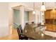 Bright kitchen featuring granite counters, a mosaic backsplash, and hardwood floors at 3231 Oak St, Wheat Ridge, CO 80033