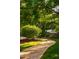 Sidewalk leading to home amid lush green landscaping at 3231 Oak St, Wheat Ridge, CO 80033