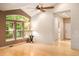 Bright living room featuring large windows, hardwood floors, and neutral tones at 3231 Oak St, Wheat Ridge, CO 80033