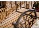 View of exterior patio with iron railing and brick wall at 3231 Oak St, Wheat Ridge, CO 80033
