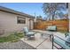 Relaxing backyard featuring patio furniture on a cement patio and a beautiful wooden fence at 4457 Wyandot St, Denver, CO 80211