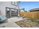 This backyard patio showcases outdoor seating and a full glass door to the house at 4457 Wyandot St, Denver, CO 80211