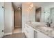 Bright bathroom with dual sinks, granite countertops, and a walk-in shower at 4457 Wyandot St, Denver, CO 80211