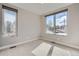 Bedroom with carpet, light walls, and two windows bringing in natural light at 4457 Wyandot St, Denver, CO 80211