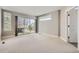 Spacious bedroom with a sliding glass door that leads out onto the deck, and neutral carpet at 4457 Wyandot St, Denver, CO 80211