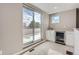 Carpeted bonus room includes wet bar, small fridge, and sliding glass doors at 4457 Wyandot St, Denver, CO 80211