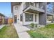 Contemporary home with a modern exterior, balcony, and manicured landscaping at 4457 Wyandot St, Denver, CO 80211
