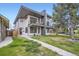 An eye-catching modern home showcasing a landscaped yard and multiple balconies at 4457 Wyandot St, Denver, CO 80211