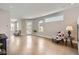 Open-concept living room with natural lighting, hardwood floors, and modern décor throughout at 4457 Wyandot St, Denver, CO 80211