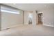Bright main bedroom featuring neutral walls, carpet, and two doorways at 4457 Wyandot St, Denver, CO 80211