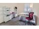 Carpeted bedroom featuring natural light and built-in storage at 17284 E Hawksbead Dr, Parker, CO 80134