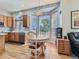 Bright breakfast nook with bay window and dining table near the kitchen at 17284 E Hawksbead Dr, Parker, CO 80134