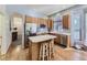 Bright kitchen with a center island, stainless steel appliances, and wooden cabinetry at 17284 E Hawksbead Dr, Parker, CO 80134