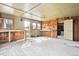 Interior of garage with workbenches and windows at 2933 Benton St, Wheat Ridge, CO 80214