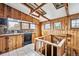 Unique kitchen with wood paneling, stone countertops, and vintage details, offering a blend of rustic and functional elements at 2933 Benton St, Wheat Ridge, CO 80214