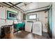 Functional laundry room with a utility sink, washer, and dryer at 2933 Benton St, Wheat Ridge, CO 80214