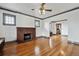 Spacious living room featuring a brick fireplace, hardwood floors, and decorative trim, blending classic and modern design at 2933 Benton St, Wheat Ridge, CO 80214