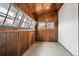 Cozy sunroom with wood paneling and multiple windows, creating a bright and welcoming space to relax and enjoy natural light at 2933 Benton St, Wheat Ridge, CO 80214
