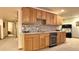 Entertainment bar area with wooden cabinets and drink refrigerator, perfect for entertaining guests at 19850 Indian Summer Ln, Monument, CO 80132