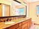 Bathroom with double sink, stone counters, and modern fixtures, offering functionality and style at 19850 Indian Summer Ln, Monument, CO 80132
