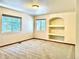 Bedroom with great natural light, a built-in shelving unit, and plush carpet at 19850 Indian Summer Ln, Monument, CO 80132