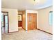 Bedroom featuring plush carpet, closet, and views to the bathroom, creating a luxurious space at 19850 Indian Summer Ln, Monument, CO 80132