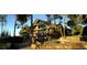 Stunning exterior of a large multi-story home with stone and wood facade, balconies, and mature landscaping at 19850 Indian Summer Ln, Monument, CO 80132
