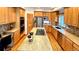 Gourmet kitchen with stainless steel appliances, a large island, and custom cabinetry at 19850 Indian Summer Ln, Monument, CO 80132