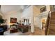 Cozy living area with a fireplace, plush seating, elegant decor, and hardwood floors at 19850 Indian Summer Ln, Monument, CO 80132
