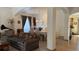 Bright and airy living room with a large window, sofa, dining table, and elegant decor at 19850 Indian Summer Ln, Monument, CO 80132