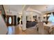 Inviting living room with an open floor plan, chandelier, and large front door at 19850 Indian Summer Ln, Monument, CO 80132