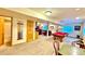 Spacious recreation room with a pool table, seating, adjacent wet bar, and multiple entry and exit points at 19850 Indian Summer Ln, Monument, CO 80132