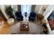 Cozy sitting area with comfortable armchairs, ottoman, side tables and a view from the balcony at 19850 Indian Summer Ln, Monument, CO 80132