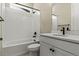 Bathroom featuring a shower-tub combination with tile surround and a modern vanity sink at 5909 S Platte Canyon Dr, Littleton, CO 80123