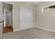 Bedroom featuring neutral carpet, a closet, and a window with natural light and neighborhood views at 5909 S Platte Canyon Dr, Littleton, CO 80123