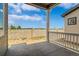 Comfortable covered patio with a stone wall and a view at 5909 S Platte Canyon Dr, Littleton, CO 80123