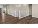 Elegant staircase with white banisters and hardwood floors, providing access to multiple levels of the home at 5909 S Platte Canyon Dr, Littleton, CO 80123