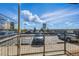 Balcony view of parking lot with cars and partial view of the building from the balcony at 13598 Via Varra # 105, Broomfield, CO 80020